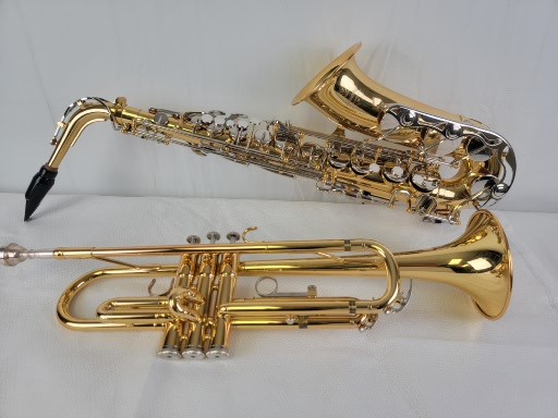 A few of the instruments we have for sale; Alto Saxophone and Trumpet
